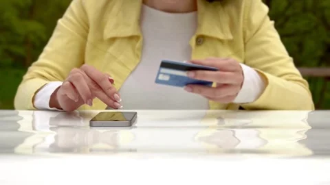 Person makes payment via on-line web store credit card data using laptop and Video stock 265927976