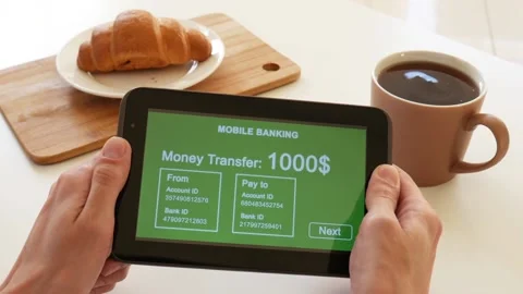A person makes a transfer using the Internet bank on his tablet Stock Footage 106830386