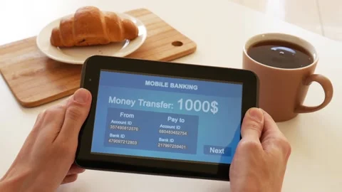 A person makes a transfer using the Internet bank on his tablet Stock Footage 106830407