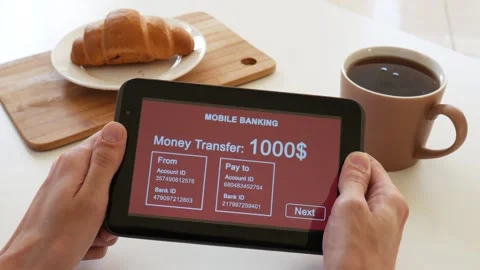A person makes a transfer using the Internet bank on his tablet Stock Footage 106830434
