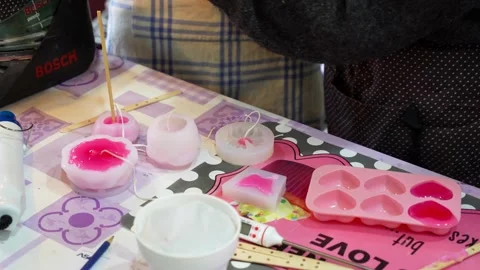 Person making decorative candles in a workshop Stock Footage 334632764