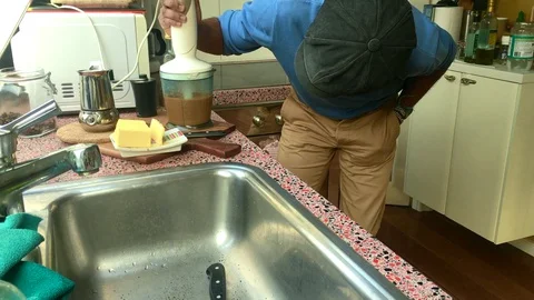 Person making delicious bulletproof coffee at home- 8s Stock Footage 128932131