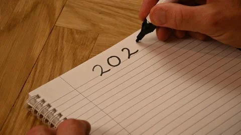 A person making a handwritten exercise in preparation for 2023 Stock Footage 221793015