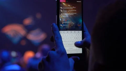 Person is making live stream with a smartphone at night event. Kyiv, Ukraine 10 Stock Footage 109437003