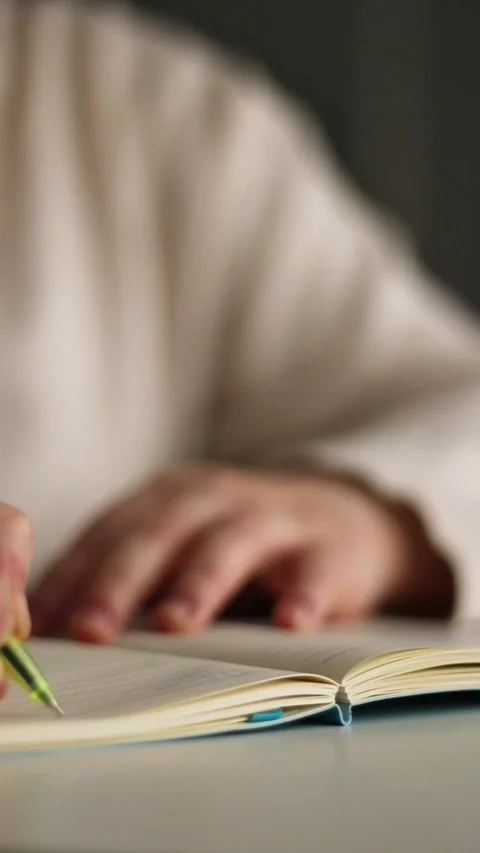 Person making notes on blank page on notebook during psychological session Stock Footage 311190170