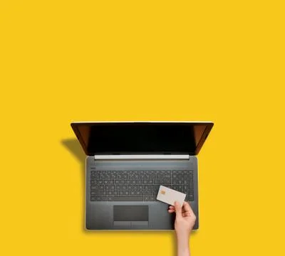 Person making online payment using laptop for shopping Stock Photos