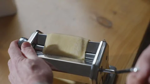 A person is making pasta with a pasta maker Stock Footage 305983374