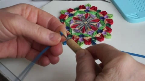 A person is making quilling ornaments from paper Stock Footage