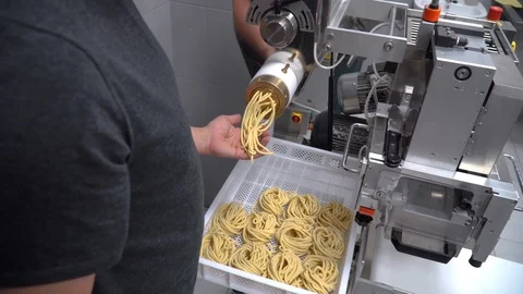 Person making spaghetti and pasta using a pasta machine Stock Footage 104016452