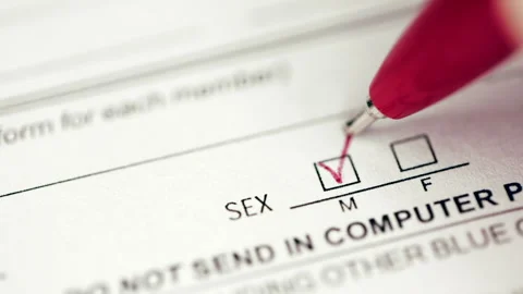 Person marking gender checkbox in a form Stock Footage 161716319