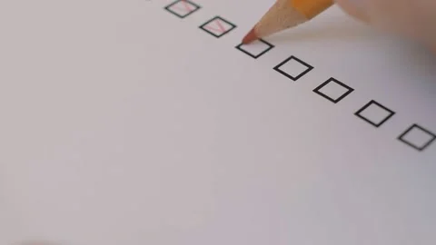 Person marking items in a questionnaire when applying for a job. Macro shot. Video stock 146685742