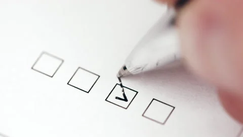 Person marking one checkbox in a form Stock Footage 161716445