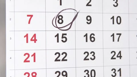A person marks an important date on the calendar. Stock Footage 313658874