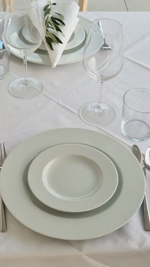 A person methodically places each item on the table Stock Footage 321135124