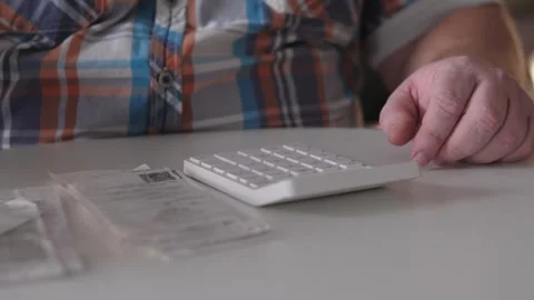 Person Methodically Sorts And Files Financial Records Peacefully, Diligent Stock Footage 327334107