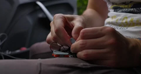 A person meticulously assembles small electronic components, capturing the Stock Footage 280256566