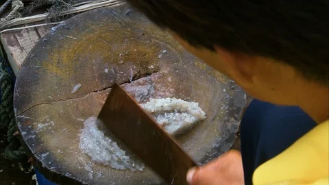 Person mincing fish on the wooden board Stock Footage 88888341