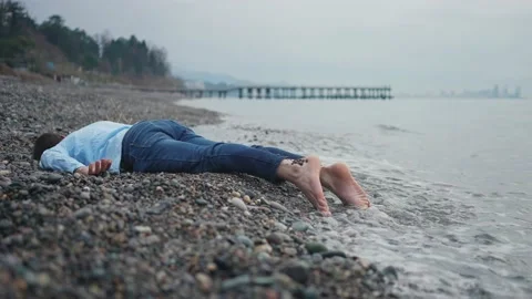 Person of the missing person drowned or shipwrecked on the beach Stock Footage 235481301