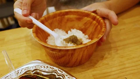 Person Mixing Crab Miso Paste with White Rice in Osaka Japan Video stock 331503783