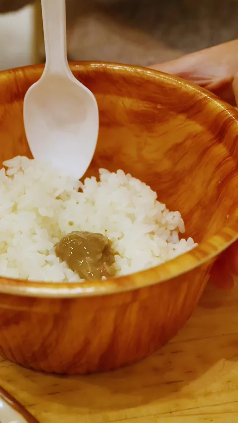 Person Mixing Crab Miso Paste into White Rice in Osaka Japan Video stock 331551406