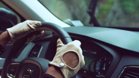 Person moving steering wheel while driving a car Stock Footage 81543414
