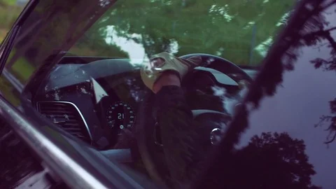 Person moving steering wheel while driving a car Stock Footage 81543468