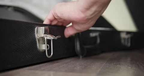 Person open guitar case Stock Footage 150490604