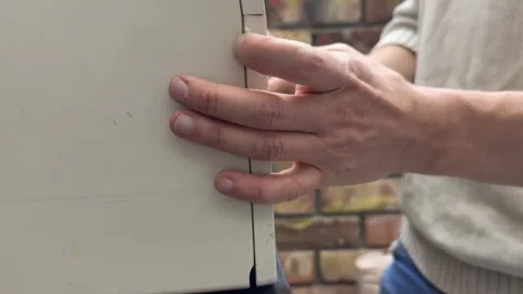 Person opening and closing the front tray of a home printer. Close up of hands Stock Footage 336977350
