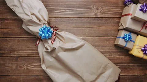 Person opening present in excitement Stock Footage 69929911