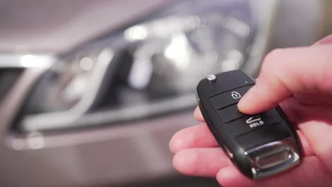 Person opens the car with the keys. Remote access to automobile. Keys for Stock Footage 185554517