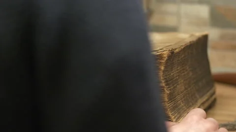 Person Opens Dusty Old Book Next to Rusty Key, Medium Stock Footage 149077167