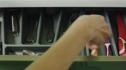 Person Opens The Kitchen Cupboard And Takes The Kitchen Knife In Hand. Stock Footage 105657574