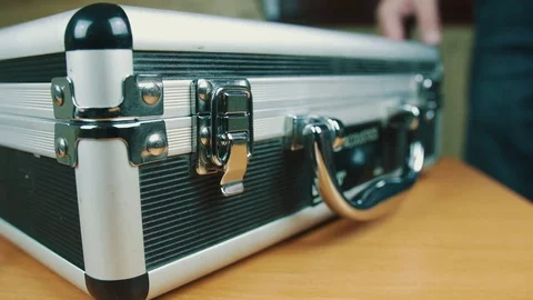 The person opens a suitcase with wires Stock Footage 70602690