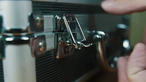 The person opens a suitcase with wires Stock Footage 70603866
