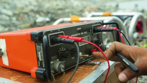 Person operating a terrameter at earthquake site Stock Footage 77451096