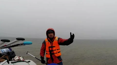 Person in an Orange Vest Explain Something Gesticulating While Other People Stock Footage 61173711