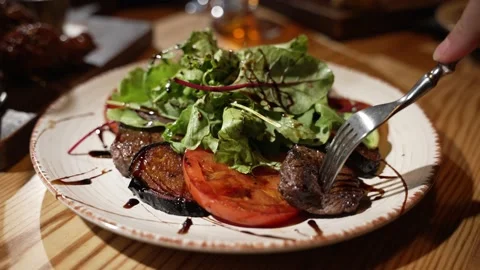 A person ordered meat and vegetables in a cafe Stock Footage 219651473