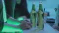 Person ordering bottled beer at the bar, enjoying nightlife HD Footage