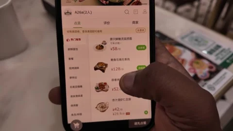 Person Ordering Food on Smartphone Using Digital Menu App in Chinese Restaurant Stock Footage 336170340