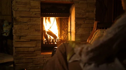 Person out of focus is looking at a large fireplace 스톡 동영상 171588604