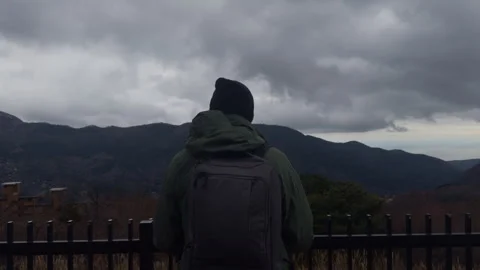 Person Overlooking Mountain 스톡 동영상 316072009