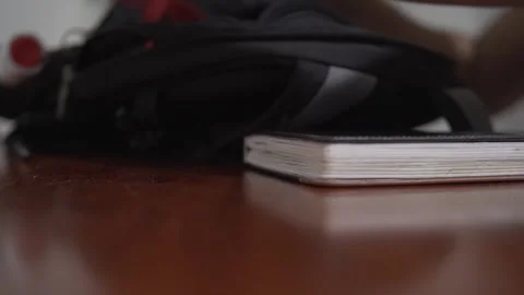 Person packing a backpack for a workout Stock Footage 320966378