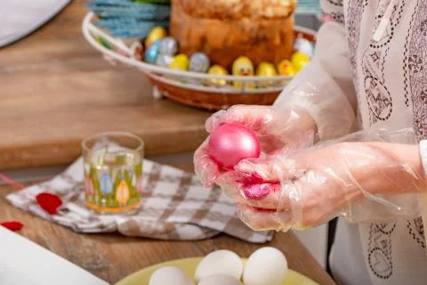 Person paint a egg made of polystyrene. Colorized acrylic egg Foto stock