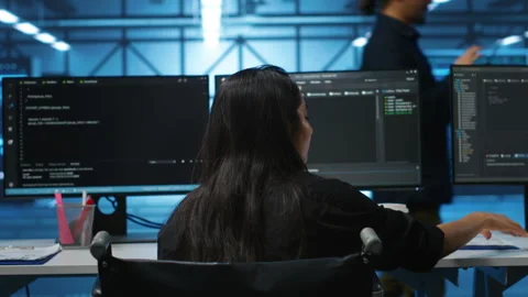 Person with paraplegia in server hub workplace doing inspection on electronics Stock Footage 276194555