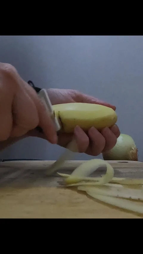 Person peeling potatoes Stock Footage 281642406
