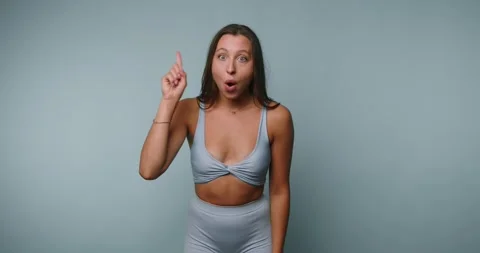 Person performs dance routine in light blue outfit in a studio setting with.. Vídeos de archivo 326788664