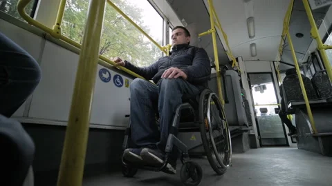 Person with a physical disability inside public transport with an accessible  Stock Footage 168174024