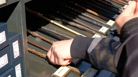 Person picking up magic wards. Harry Potter Universal Studio. Wizard wand. Stock Footage 132608609