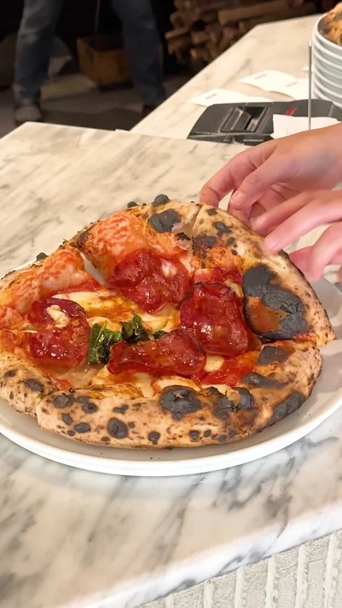 Person Picking Up Slice of Pepperoni Pizza on Marble Table Stock Footage 338319155