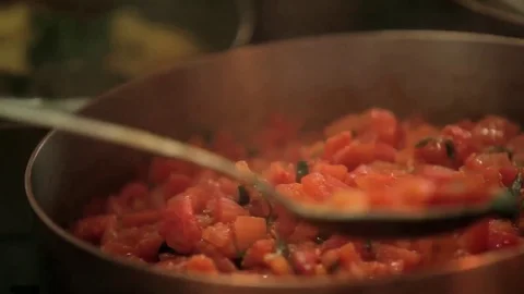 Person picking tomato sauce Stock Footage 77759853